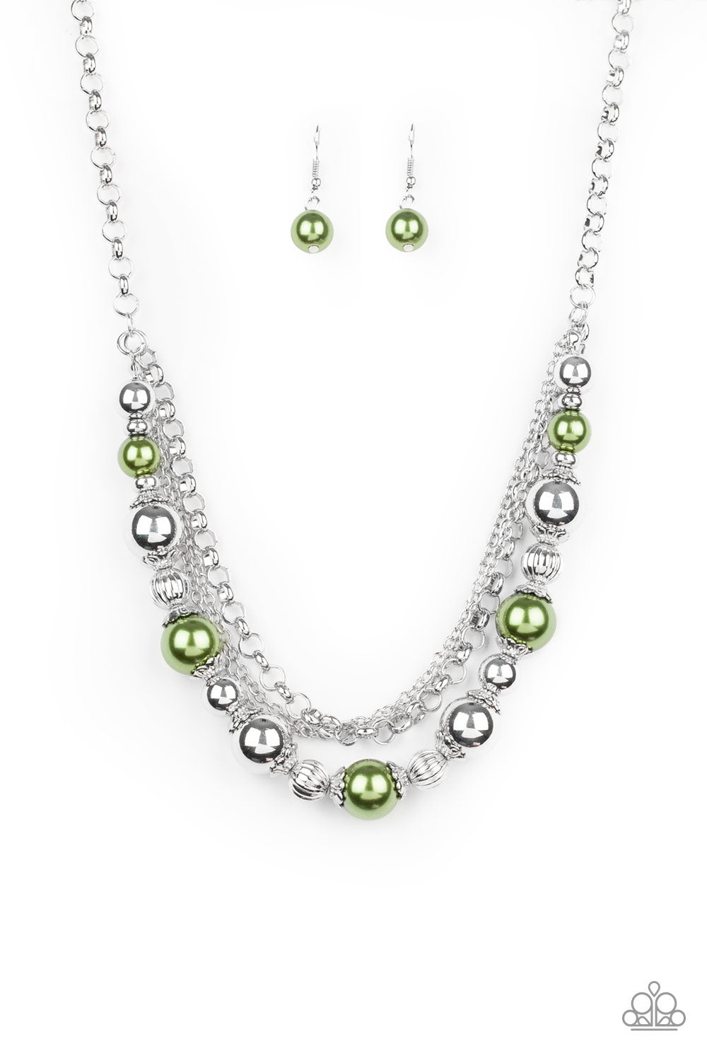 Layers of mismatched silver chains give way to a strand of ornate silver beads and oversized green pearls that cascade below the collar for a refined flair