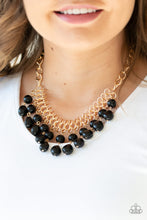 Load image into Gallery viewer, imperfect black beads dangle from a web of interlocking gold links below the collar